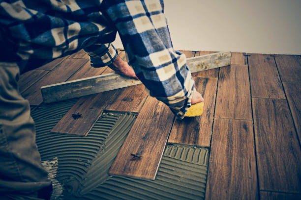 Mature mason cleaning tiles